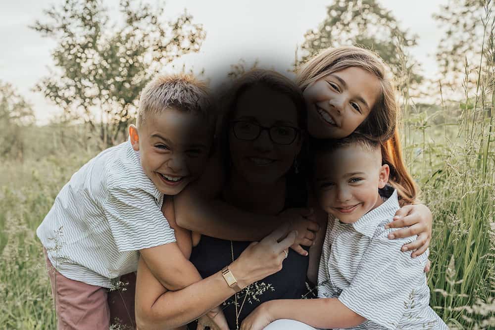 A family portrait partially obscured by a dark central shadow.