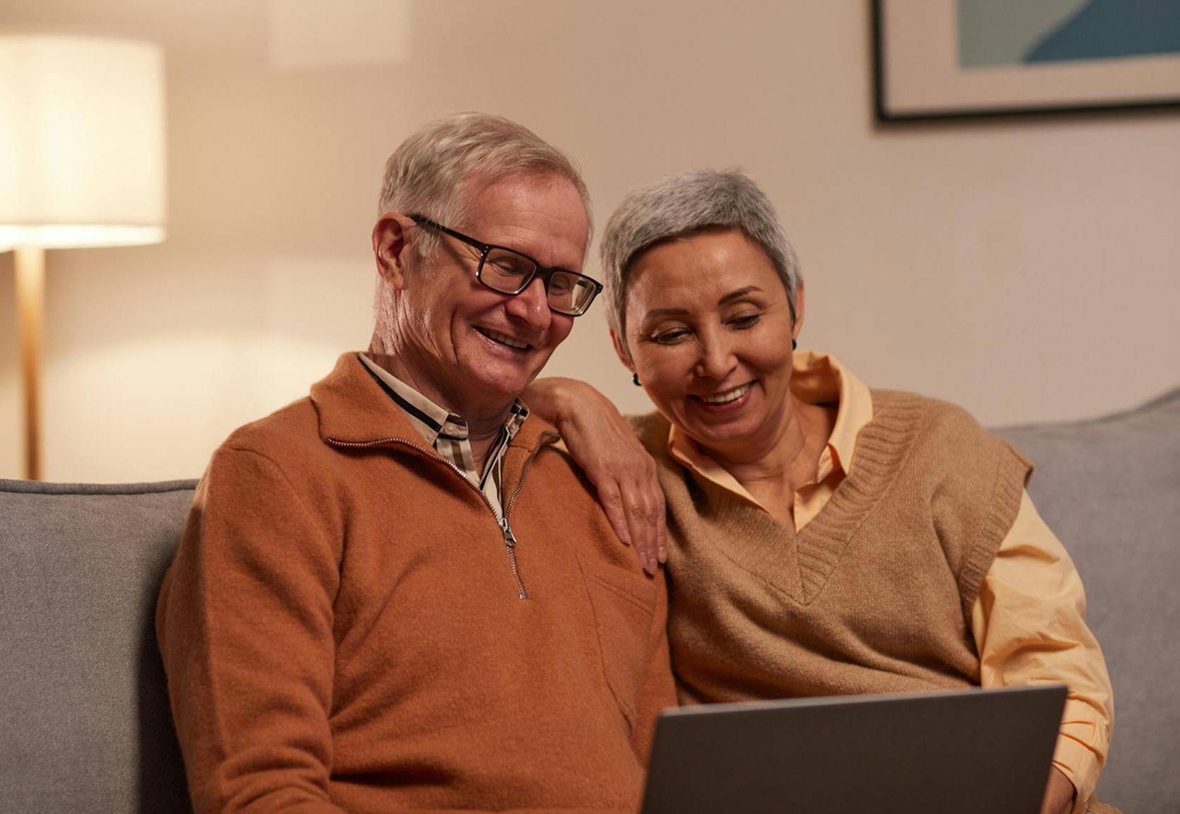Smiling couple in a video call at home